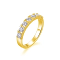 Close-up of 7 round-cut moissanite stones in a 18K gold plated S925 silver prong setting - US Size 5 / Gold