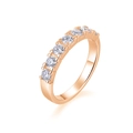 Close-up of a half-eternity rose gold S925 silver ring with seven round-cut stones - US Size 5 / Rose Gold