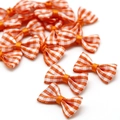 Oranje en wit geblokte strikjes voor DIY haaraccessoires en knutselprojecten - Oranjerood