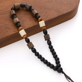 Laccetto da polso con perline di legno, resina nera e pietra bianca con cordino intrecciato - Modello #04