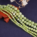 Detailed view of natural light green jadeite round beads in various sizes for DIY jewelry - Diameter 4 / Natural Southern Jade