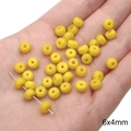 Leuchtend gelbe 6x4mm Glasschliffperlen für DIY-Schmuck, präsentiert in der Hand - 20 Stk./Packung / 6x4mm / Gelb