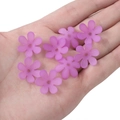 Matte purple 20mm acrylic six-petal flower beads held in hand for DIY jewelry making - Six-Petal Flower / 50 Pieces/Pack (20mm) / Purple