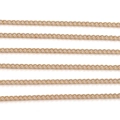 Macro detail of high-quality rose gold curb chains for jewelry making and decoration - 1.3mm 1m/Pack / KC Gold