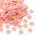 Fiori in resina rosa pastello a cinque petali con centro giallo per accessori capelli DIY - 7mm (50 pezzi/confezione) / Rosa