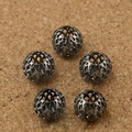 Five gunmetal hollow geometric sphere beads for DIY jewelry making on cork background - 9×10mm (6 Pieces/Pack) / Gunmetal