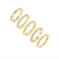 Macro detail of five assorted gold-plated S925 silver rings with sparkling zircon inlay - US Size 5 / Moissanite Stackable Ring