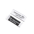 Black and white woven handmade clothing labels with 'hand made with love' text - 50x15mm / White