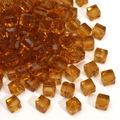 Faceted amber glass cube beads with center hole for DIY jewelry making and bracelets - 6mm / Brown & Yellow