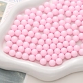 Perline in acrilico rosa chiaro per gioielli fai-da-te esposte su vassoio - Rosa
