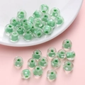 Perle in vetro verde a pois bianchi per la creazione di gioielli e bracciali DIY - 12x8mm / Verde