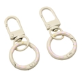 Cremeweißer Schlüsselanhänger aus Metall mit rosa und gelben Punkten im Set - Gesamtlänge ca. 52 mm Schnallengröße 12 x 32 mm Federverschluss-Außendurchmesser 24 mm Dicke ca. 3 mm / 1 Stück / Hellgelb