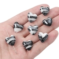 Close-up of black and white marble patterned heart-shaped glass beads for DIY jewelry making - 15x15mm (2 Pieces) / Black and White Quicksand Pattern Heart