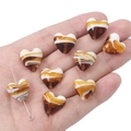 Macro shot of 12mm heart-shaped glass beads with amber texture for DIY jewelry making - 15x15mm (2 Pieces) / Caramel Quicksand Pattern Heart