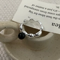 Macro shot of S925 sterling silver liquid lava ring with black onyx bead detail - US Size 7 / Irregular Wave Black Agate Style