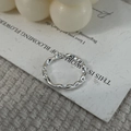 Macro shot of S925 sterling silver stamp on irregular textured adjustable ring band - Adjustable Open / Silver