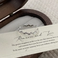 Macro detail of S925 sterling silver olive leaf ring with cubic zirconia inlays - Adjustable Open / Silver