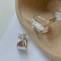 Detail view of organic minimalist S925 sterling silver earrings with hallmark stamp - Silver
