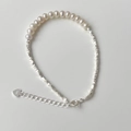 Detailed macro shot of 925 sterling silver heart charm and freshwater pearl bracelet - 925 Silver / Silver