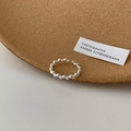Detailed view of S925 sterling silver hollow geometric ring on cork and white surface - Adjustable Open / Sterling Silver Color-Beaded Dot Style
