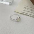 Detailed shot of an S925 silver ring featuring a white chalcedony stone and textured band - Adjustable Open / Silver-White Chalcedony