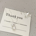 Detail of S925 silver necklace featuring a round bead and drop pearl pendant on a card - 925 Silver / Silver