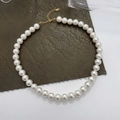 Detailed view of 925 sterling silver pearl necklace with gold lobster clasp and extension chain - 925 Silver / 12mm