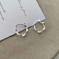 Detailed close-up of S925 sterling silver hoop earrings with irregular liquid metal texture - 925 Silver / Silver