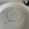 Detailed macro view of S925 sterling silver bracelet chain with spring clasp and logo tag - 925 Silver / Silver