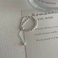 Detailed shot of S925 sterling silver beaded double layer ring with tassel charm - Adjustable Open / Silver