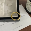 Macro detail of golden irregular wave ring with matte finish on a jewelry box edge - Adjustable Open / Gold