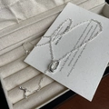 Macro detail of 925 sterling silver necklace showing S925 hallmark and fishtail pendant - 925 Silver / Silver
