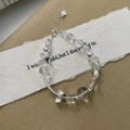 Detail of S925 sterling silver beaded bracelet with clear crystal and bow charm pendant - White Crystal