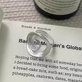 Macro shot of a matte silver spiral ring with brushed texture on vintage book pages - Adjustable Open / Silver