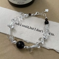 Detail of S925 silver beaded bracelet with white crystal and silver bow charm - Smoky Quartz