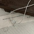 Macro detail of S925 sterling silver toggle clasp necklace with white beads and silver ball - 925 Silver / Silver