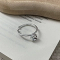 Macro shot of S925 sterling silver geometric square zircon ring on a rustic wooden tray - Adjustable Open / Silver
