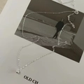 Minimalist S925 sterling silver ball pendant necklace on an artistic magazine - 925 Silver / Silver