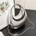 Futuristic silver acrylic oval handbag with round top handle and metal chain strap - Silver