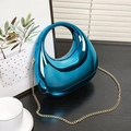 Metallic blue acrylic evening handbag with streamlined shape and gold chain strap - Blue