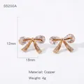 Boucles d'oreilles papillon élégantes en cuivre or rose avec pierres en zircone cubique - Style de Nœud Pavé (NYH-SS200A)