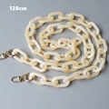 Detail view of 120cm beige amber resin bag strap with golden lobster clasps - Beige Marble (120cm)
