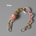 Detail shot of 31cm pink marble acrylic resin handbag chain with gold metal clasps - 31cm / Pink