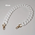 Detailed view of a 65cm matte white acrylic bag chain with sturdy gold lobster clasps - 65cm / Clear White