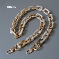 Detalle de correa de cadena de 80 cm en acrílico mármol crema y ámbar con hebillas oro - 80cm / Hebilla de Morseto