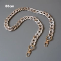 Macro detail of 80cm marble resin acrylic bag chain with golden metal snap hooks - 80cm / Fishbone