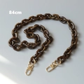 Detail view of 84cm brown resin acrylic chain with tortoise pattern and gold metal clasps - Medium-Long Style / Brown