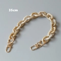 Detail view of 35cm cream marble resin strap with golden metal lobster clasps - 35cm / Marble Beige