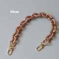 Detailed view of 35cm peach marble resin bag chain with gold metal lobster clasps - 35cm / Pink