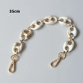 Detail view of a 35cm acrylic resin handbag chain with marble pattern and gold lobster clasps - Beige-35CM